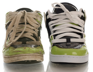 one new shoe and one worn out shoe