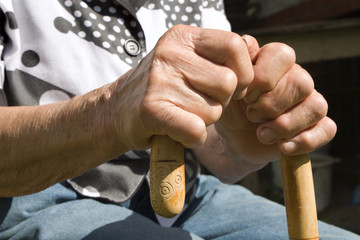 hands of old woman with stick