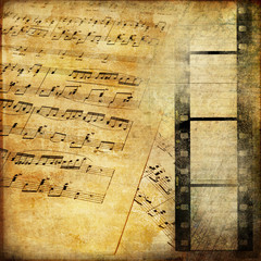 vintage background with musical pages and filmstrip