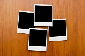 Blank photo frames on board