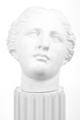 Ancient Greek bust on column over white background