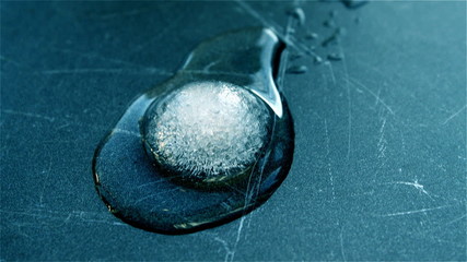 Melting Circular Ice Cube Reversed - Powered by Adobe