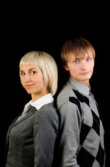 Businesspeople standing confidently isolated on black