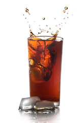 Beautiful splash of cola in glass isolated on white