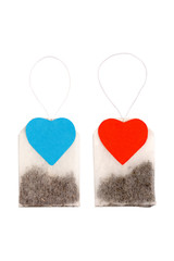 Tea bags with heart-shaped labels isolated