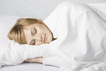 girl sleep in a white bed