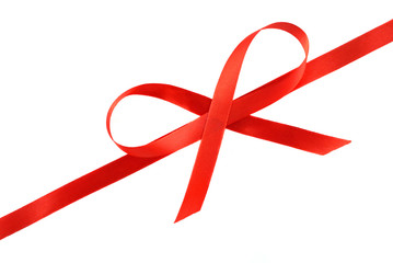 Red holiday bow on white background.