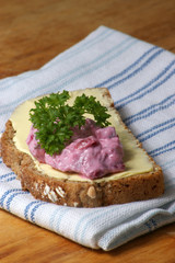 red organic herring salad on soda bread