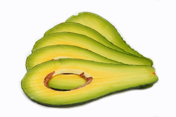 Section of avocado with stone isolated on white background