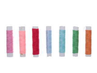 colored thread rolls isolated on the white background