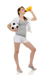 young woman clothed in sportswear with soccer ball
