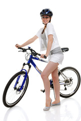 Young beautiful girl with her bike.