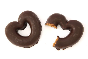 Chocolate covered gingerbread hearts one partially bitten