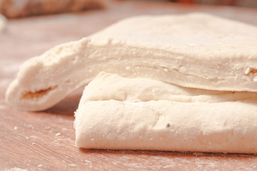 dough on  wooden board.