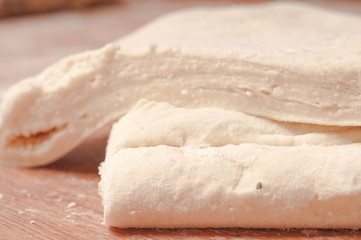 dough on  wooden board.