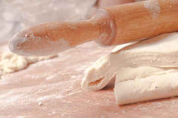 dough on  wooden board.
