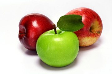 Green and red apples on white