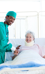 Surgeon attending a patient after an operation