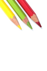 color pencils (red, yellow and green) close-up isolated on white