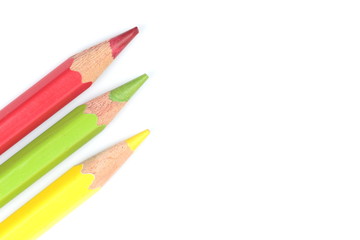 color pencils (red, yellow and green) close-up isolated on white