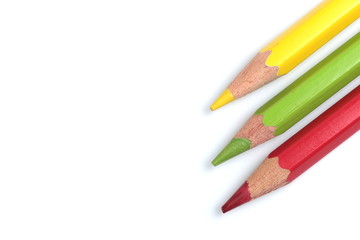 color pencils (red, yellow and green) close-up isolated on white