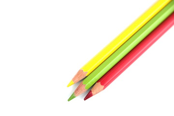 color pencils (red, yellow and green) close-up isolated on white