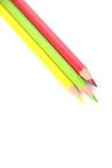 color pencils (red, yellow and green) close-up isolated on white