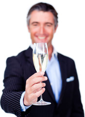 Successful businessman toasting with Champagne