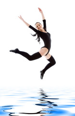 Fototapeta na wymiar jumping girl in black leotard