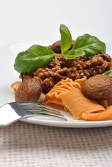 home made pasta with mince sauce and basil