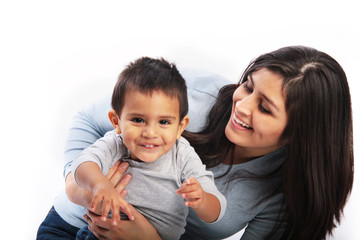 Young mother holding toddler back