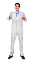 Successful businessman standing with thumbs up