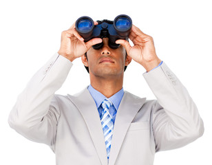 Serious businessman using binoculars