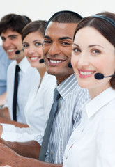 Customer service agents smiling at the camera