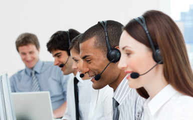 Multi-ethnic customer service agents in a call center