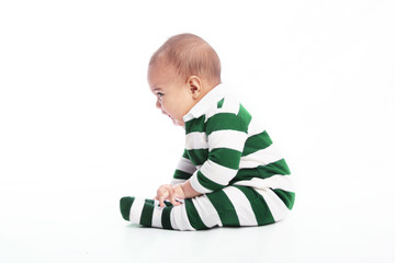 Infant boy sitting down crying