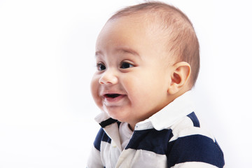 Face of a cute chubby happy baby smiling