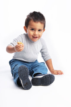Toddler holding snack
