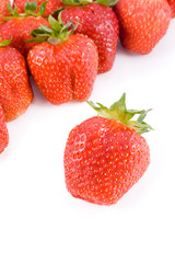 Ripe red strawberries on white background