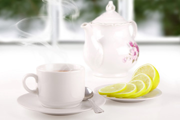 morning tea on the window sill on the background of a frosty win