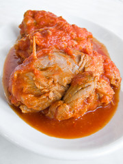 Meat roulade with tomato sauce on plate