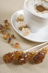 Cappuccino coffee cup with brown sugar