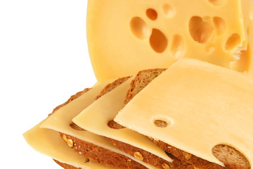 chunk of yellow cheese with slices