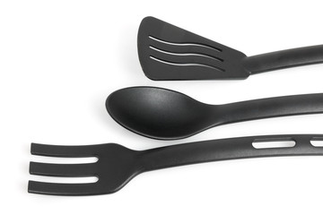 Black kitchen tools over white background