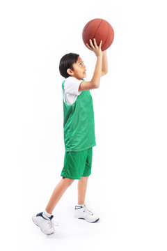 Kid playing with basketball