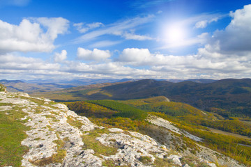 mountain and sky with sun