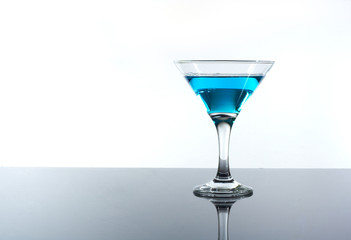 blue drink alcohol in a glass on the table