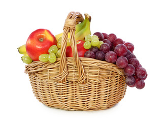 Fruits in basket isolated on white background.