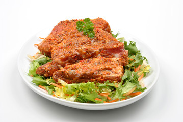 some marinated organic rib on healthy salad