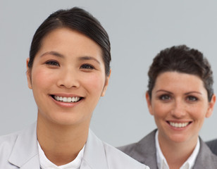 Smiling Business co-workers standing in a line